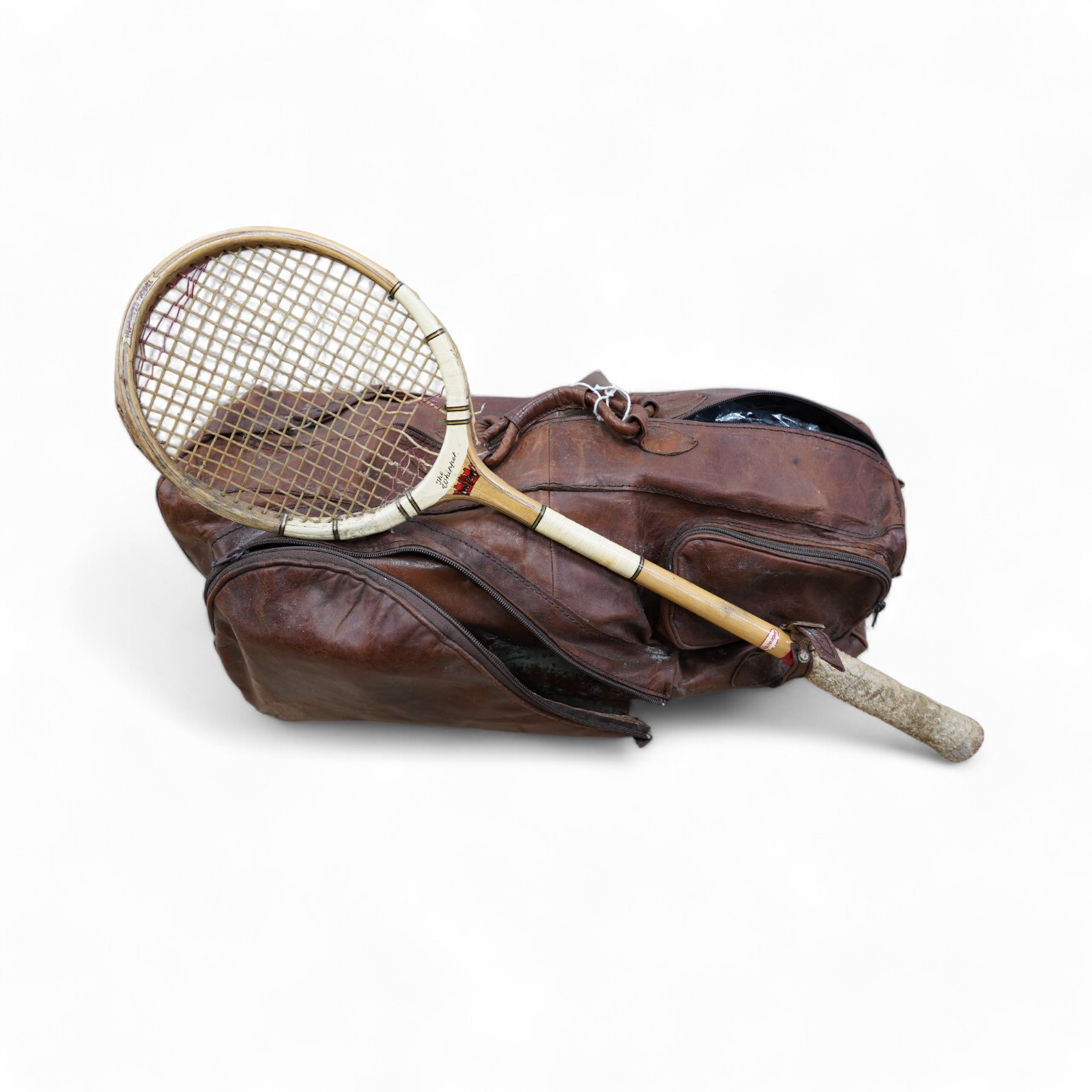 A leather sports holdall, with squash racket. Condition - poor to fair